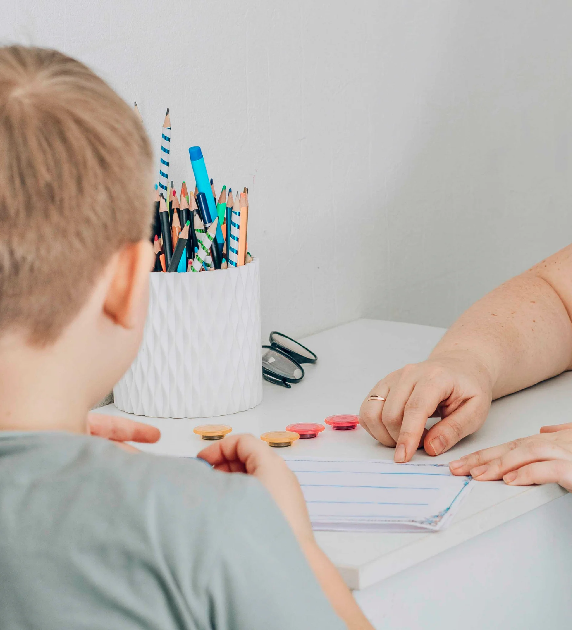 Young boy working with a specialist in ABA therapy